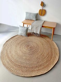 A round jute rug can be a versatile and stylish addition to various areas in your home. Here are some popular places and occasions where you might consider using a round jute rug: Living Room: Place a round jute rug under a coffee table or in the center of your seating arrangement to define the space and add a natural, earthy touch to the room. Dining Area: If you have a round dining table, a round jute rug can complement the shape and add warmth to the dining area. Ensure that the rug is large Round Table With Round Rug, Round Jute Rug, Small Sitting Area, Jute Round Rug, Popular Places, Living Room Nursery, Braided Jute Rug, Outdoor Material, Reading Corner