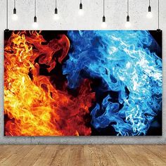 a wall hanging on the side of a room with fire and blue flames in it