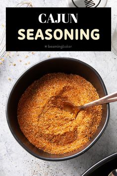 a bowl filled with cajun seasoning on top of a table