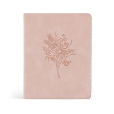 a pink notebook with flowers on it