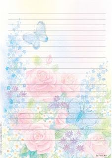 a notepad with flowers and butterflies on the paper, which is lined in blue and pink