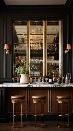 an elegant bar with stools in front of it