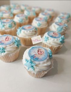 cupcakes decorated with frosting and blue decorations