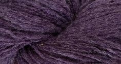 purple yarn is shown in this close up shot, with the end of it's wool