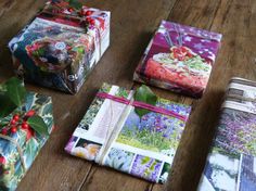 several wrapped presents sitting on top of a wooden table