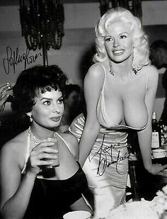 an old photo of two women at a party