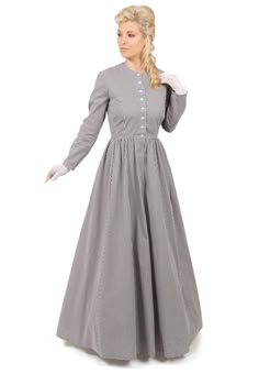 A lovely versatile dress for any occasion! Traditional Victorian print dress has fitted bodice with front button closure. Dress has simple long slim sleeves. Charming full three-gored skirt completes the look. Delightful dress can be dressed up with lacy jabots, collars, cuffs, hats, or gloves. For a prairie Homestead look, wrap an apron around the waist. A great dress for re-enactments! Hand wash or machine wash gently. Tumble dry low or hang to dry. The models are wearing a hat, gloves, a crin 1860 Work Dress Pattern, Work Dress Pattern, Outlander Fashion, 1870s Dress, Pioneer Clothing, Prairie Homestead, Pioneer Dress, Gigi Dress, Calico Dress