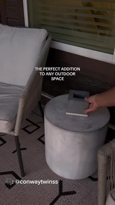 a person is cleaning the floor with a mop and duster in front of a chair