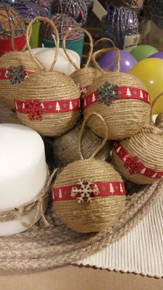 some burlocks are wrapped in twine and decorated with christmas decorations on them