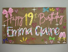 a birthday sign is hanging on the wall