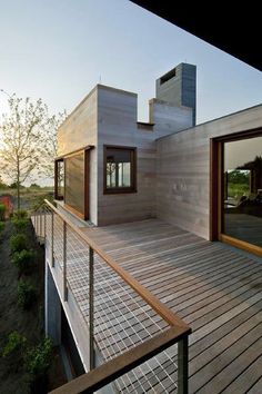 a wooden deck leading up to a house