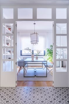 an open door leading into a dining room