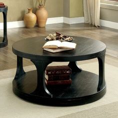 a black coffee table with books on it