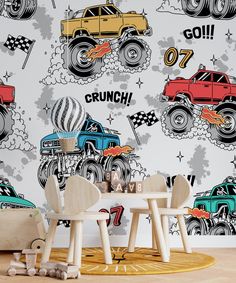 two children's chairs in front of a wall with monster trucks and hot wheels on it