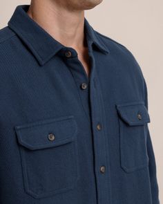 Embrace the season in style with the Beachwood Solid Twill Shirt. This 100% cotton twill button down features two chest pockets with buttoned flaps that provide a touch of utility and classic sophistication. Wear this men's shirt buttoned up for a sophisticated look, or leave it open and layered for a more relaxed outfit. Style: 11174 Navy Button-up Shirt With Pockets, Winter Cotton Tops With Buttoned Pockets, Navy Cotton Outerwear With Buttoned Pockets, Winter Cotton Shirt With Button Closure, Winter Cotton Shirt With Buttons, Winter Cotton Shirt, Navy Relaxed Fit Shirt With Buttons, Blue Cotton Tops With Buttoned Pockets, Cotton Shirt With Snap Buttons For Fall