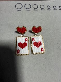 the earrings are made out of bead and have hearts on them