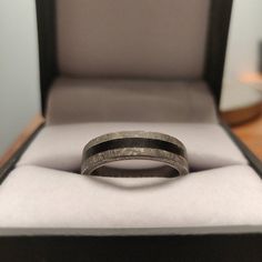 an open box with a ring in it