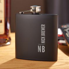 a black flask is sitting on a table