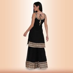 Introducing our new Elegant Garara Set with Gold Accent - Black! This garara set is perfect for any special occasion, whether you're attending a wedding or just want to dress up for a night out. The heavy gold gota accents on the edge of the top, garara, and dupatta add a touch of luxury, while the simple design keeps it elegant and timeless. We know you'll love this garara set as much as we do! Fabric for sleeves is included in all of our clothing, unless specified otherwise. Black Garara Suit, Black Floor-length Sharara For Festivals, Festive Floor-length Black Sharara, Black And Gold Sharara, Garara Dress Black And Golden, Ready To Wear Saree, Sari Blouse, Exclusive Collection, Saree Blouse