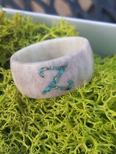 Antler Ring with monogram Turquoise Inlay.  Each ring is carved by hand. Due to the natural, handmade nature of antler rings, each ring is unique in the color and grain pattern of the ring. Rings are crafted from Illinois Whitetail Antler, which is naturally shed by the deer each year.   Any Single letter is available! Multiple letters are available by request for an extra charge, just ask me for a custom listing Antler Rings Women, Deer Horn Jewelry, Antler Engagement Ring, Antler Rings, Bullet Casing Jewelry, Deer Antler Crafts, Antler Carving, Deer Antler Ring, Antler Earrings