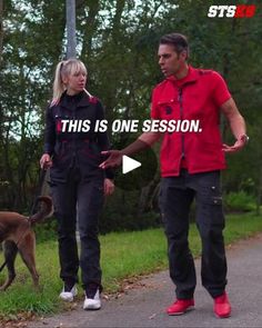 the man and woman are walking their dog down the road with one hand in his other's pocket