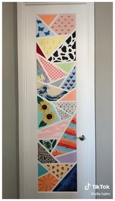 the door is decorated with colorful paper and has a bird on it's side