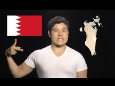 a man is pointing to the map of qatar with his hand in front of him