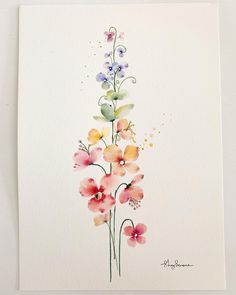 watercolor painting of flowers on white paper