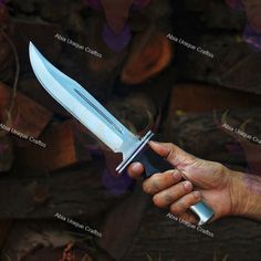 a man holding a knife in his hand with the blades still attached to it's blade