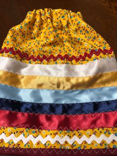 "18-24 months Child's ribbon skirt with yellow calico cotton blend fabric. Waist 17\", length 9 3/4\", width 34\". Many blessings!" Ribbon Dresses, Ribbon Skirt, Baby Girls Dresses, Beginner Quilt, Toddler Skirt, Native American Clothing, Ribbon Skirts, Ribbon Dress, Beginner Quilt Patterns