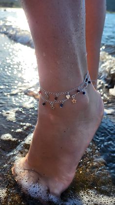 "Join in the beauty of harmony with our \"In Balance with Nature\" Boho Style Anklets.  Designed for nature lovers, beach enthusiasts, and artistic souls, this anklet is a true embodiment of carefree, Greek Summer vibes. Crafted with love using strong sterling silver curb chain, adorned with little sterling silver star charms and small sodalite gemstones, this anklet exudes a sense of natural elegance. The sodalite gemstones, known for their calming properties, add a touch of serenity to your ev Handmade Silver Strand Anklets, Silver Bohemian Strand Anklets, Festive Bohemian Silver Beads Anklets, Silver Bohemian Anklets For Festivals, Bohemian Strand Anklet With Starfish Charm, Silver Anklets With Starfish Charm For Beach, Starfish Anklets, Star Anklet, Foot Bracelet