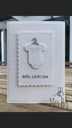 a card with a baby's shirt on it and the words hello little one