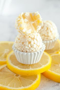 lemons and marshmallows are stacked on top of each other with white frosting