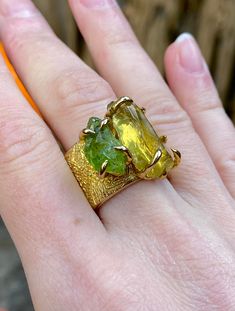 High quality Peridot (green) and Citrine (yellow) gemstones on a brass band. One of a kind! Size 7 and 7.5. Handmade with love and expertise! If you would like any adjustments like ring size or stone type/color or metal type (gold, rose gold, silver, or brass) I do make custom designs, just reach out :) Green Citrine Gemstone Rings, Green Citrine Rings For Gifts, Green Citrine Jewelry For Anniversary, Fusion Style Citrine Gold Jewelry, Gold Rings With Natural Stones And Citrine, Handmade Green Brass Rings, Green Citrine Jewelry With Natural Stones, Yellow Peridot Jewelry For May Birthstone, Adjustable Green Multi-stone Ring