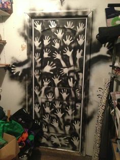 a black and white door with hand prints on it