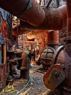 an old factory with rusty pipes and machinery