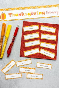 a table topped with lots of writing and markers