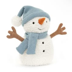 a stuffed snowman wearing a blue hat and scarf