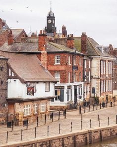 there are many buildings along the water side