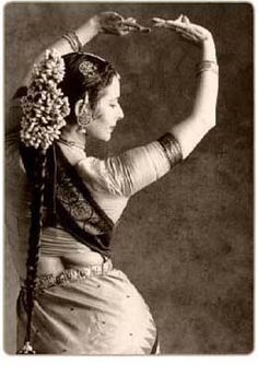 an old fashion photo of a woman with her hands on her head and arms in the air