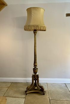 Outstanding quality antique Victorian French carved gilded standard lamp, having a reeded carved tapering gilded column supported by three shaped carved cabriole scroll supports, standing on a shaped platform base with original turned feet. D. 1860 H 202cm W 56cm D 56cm Antique Floor Lamps Victorian, Victorian Standing Lamp, Antique Floor Lamps, Standard Lamp, Standard Lamps, Standing Lamp, Live Light, Antique Victorian, Floor Lamps