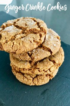 a stack of cookies sitting on top of a blue countertop covered in powdered sugar