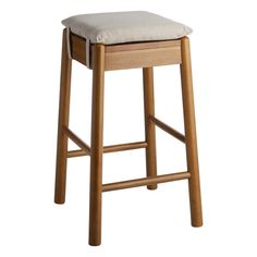 a wooden stool with a cushion on the seat and back rests against a white background