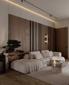 a living room filled with furniture and a tree in the corner on the side wall