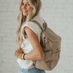 Introducing The Capri, a versatile and chic backpack that is ideal not only for on-the-go moms but also for professionals, travelers, and everyday users. Crafted from resilient microfiber leather, The Capri stands up to daily challenges, resisting cracks, chips, or peels. Its multiple compartments cater to both baby essentials and professional needs, ensuring everything has its place. Effortless to clean, it's the perfect companion for life's little spills, whether from a baby bottle or a coffee cup. With The Capri on your back, step out into the world with style and assurance, no matter your journey. Chic Backpack, Vegan Leather Backpack, Daily Challenges, Backpack Travel Bag, White Stain, Diaper Bag Backpack, Tablet Sleeve, Baby Bottle, Black Friday Shopping