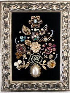 an ornate silver frame with pearls, jewels and other decorative items