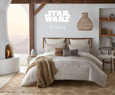 a star wars themed bedroom is shown in white and brown colors with the bed made up