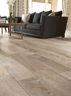 an image of a living room with wood flooring on the walls and in the floors