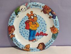 a plate with cartoon characters painted on it