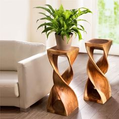 two wooden side tables sitting on top of a hard wood floor